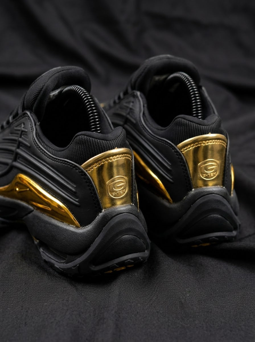Nike Hot Step 2 x NOCTA Negro / Dorado Cromado