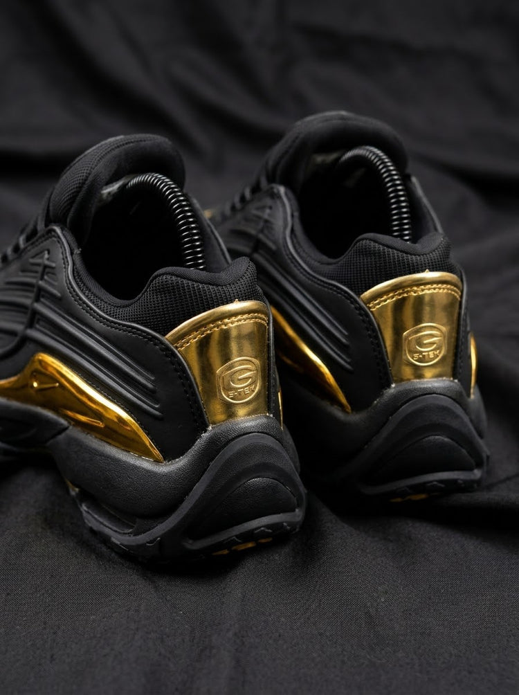Nike Hot Step 2 x NOCTA Negro / Dorado Cromado