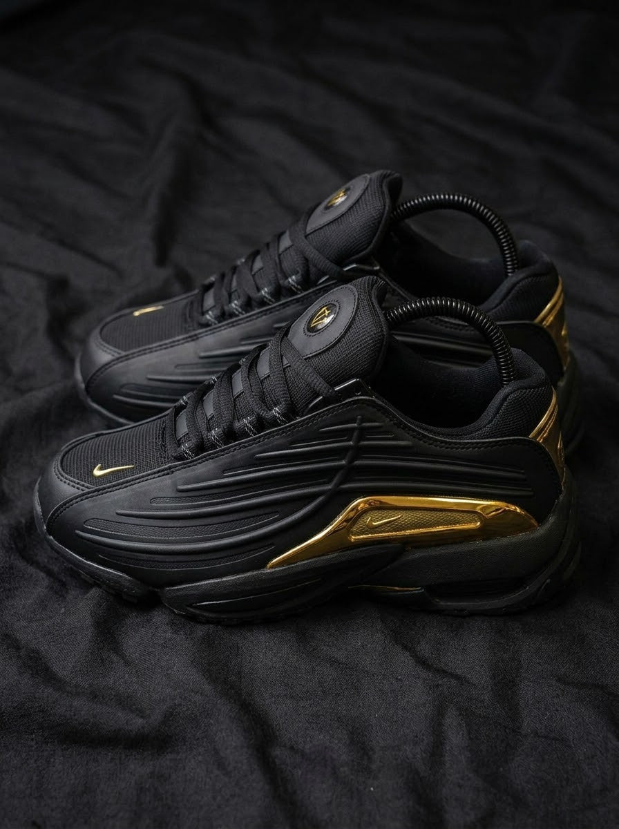 Nike Hot Step 2 x NOCTA Negro / Dorado Cromado
